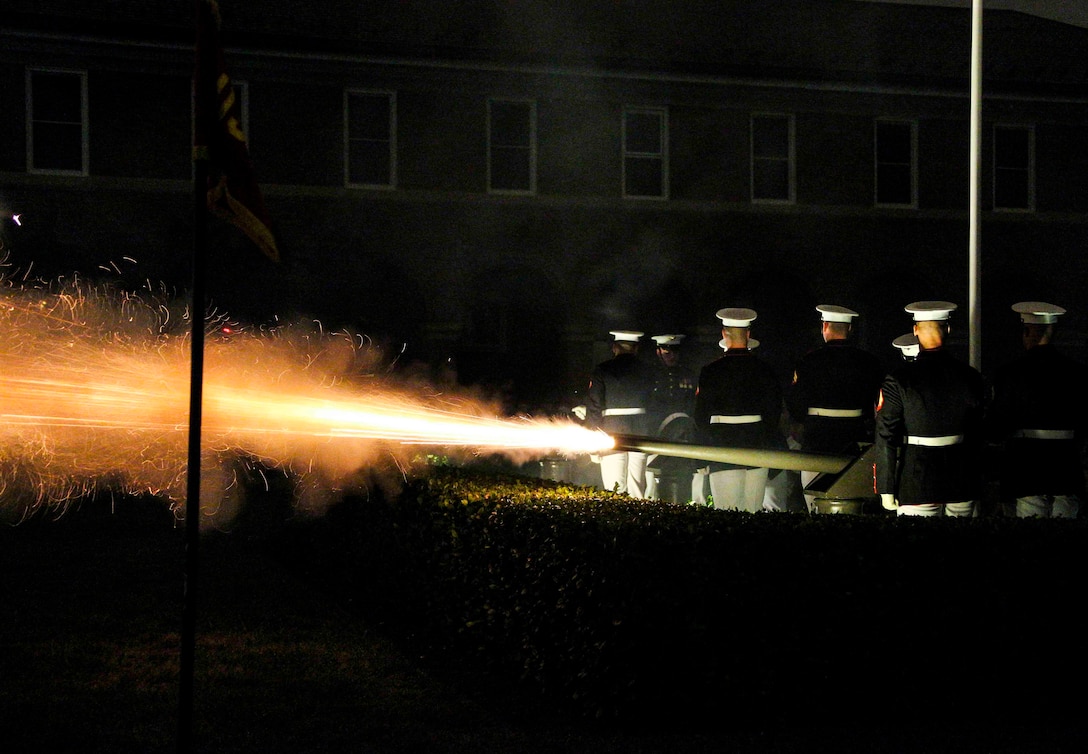 Marine Corps Body Bearers fire canons during an evening parade at Marine Barracks Washington, Washington D.C., Aug. 31, 2018. Commandant of the Marine Corps Gen. Robert B. Neller hosted the parade and the guest of honor was Dr. Betty Moseley Brown.