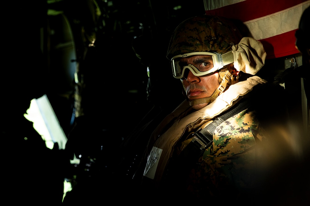 Sgt. Maj. Edwin A. Mota, sergeant major of the 31st Marine Expeditionary Unit, rides aboard an MV-22B Osprey tiltrotor aircraft during free-fall parachute jump training, Okinawa, Japan, Aug. 29, 2018. The Osprey belongs to Marine Medium Tiltrotor Squadron 262 (Reinforced), the Aviation Combat Element for the 31st MEU. During the training, Amphibious Reconnaissance Marines with the 31st MEU flew to a spot above a landing zone on Ie Shima Training Facility, off Okinawa’s northwest coast, before exiting a cruising MV-22B – from there, the Marines fell for approximately 50 seconds before deploying parachutes to land safely. The 31st MEU, the Marine Corps’ only continuously forward-deployed MEU, provides a flexible force ready to perform a wide-range of military operations across the Indo-Pacific region.