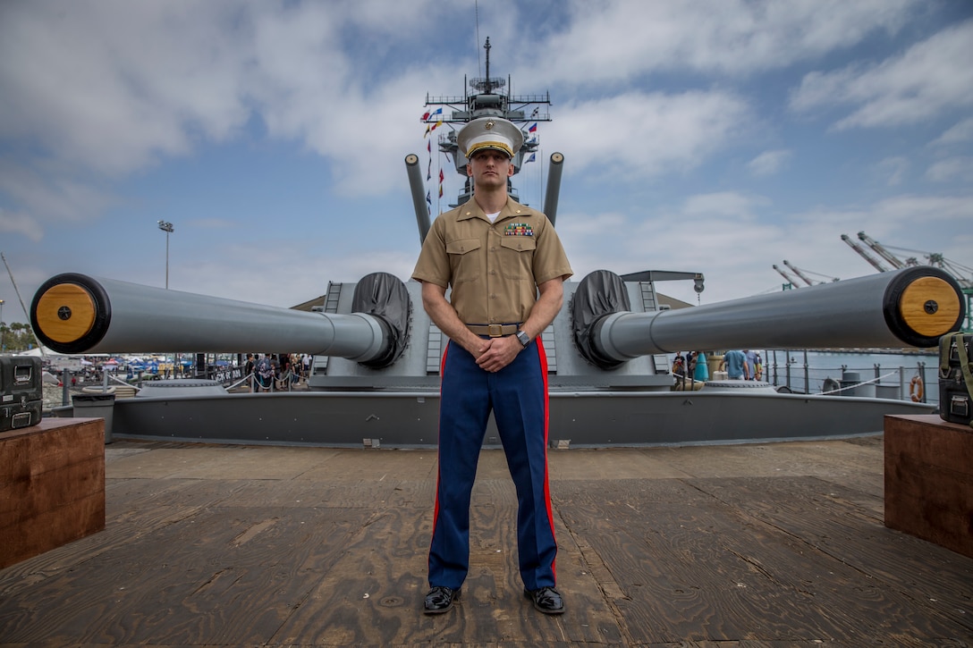 U.S. Marine Corps Maj. Scott Sasser, a media operations officer with I Marine Expeditionary Force, poses for a photo following his promotion ceremony where he was promoted from Captain to Major aboard the USS Iowa during Los Angeles Fleet Week, Sept. 1, 2018. The residents of San Pedro, Calif., were invited to view the promotion as Sasser was promoted from a company-grade officer to a field-grade officer. Commissioned officer ranks are subdivided into generals, field-grade, and company-grade officers. Through fleet weeks, the military gains the opportunity to educate area leaders and the general public about the Marine Corps and Navy.