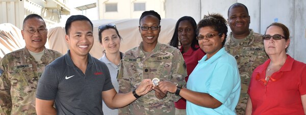 The Contracting team receives a Transatlantic Division coin for expediting the contract award schedule for the Design and construction of Entry Control Point #3 at Bagram Airfield, Parwan Province, Afghanistan. 
Doing Business with the Afghanistan District is as easy as clicking on the link: https://www.tad.usace.army.mil/About/Afghanistan-District/Contracting-With-Us/