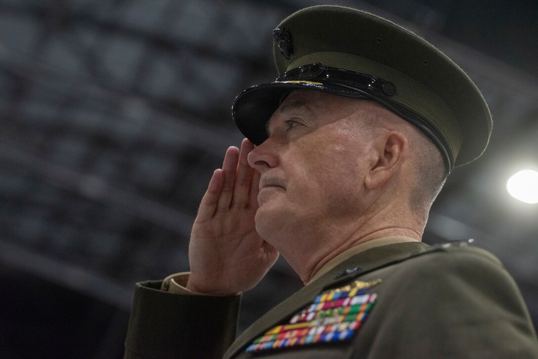 Marine Corps Gen. Joe Dunford, chairman of the Joint Chiefs of Staff, salutes.