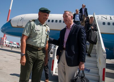 A Greek soldier welcomes Marine Corps Gen. Joe Dunford, chairman of the Joint Chiefs of Staff, to Athens, Greece.