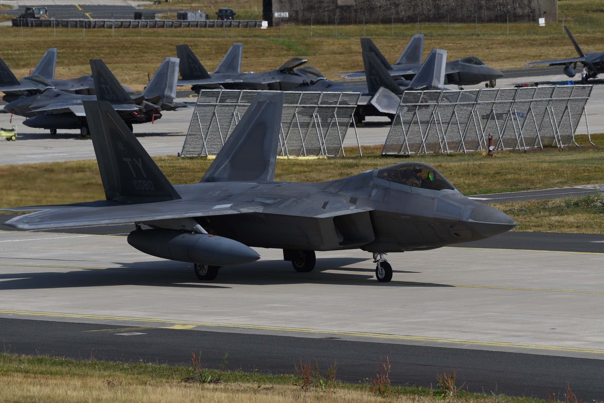A U.S. Air Force F-22 Raptor from the 95th Fighter Squadron, 325th Fighter Wing, at Tyndall Air Force Base, Fla., taxis on the flightline at Spangdahlem Air Base, Germany, Aug. 29, 2018. The F-22s are heading back home after completing a Flying Training Deployment with other NATO partners. (U.S. Air Force photo by Airman 1st Class Branden Rae)