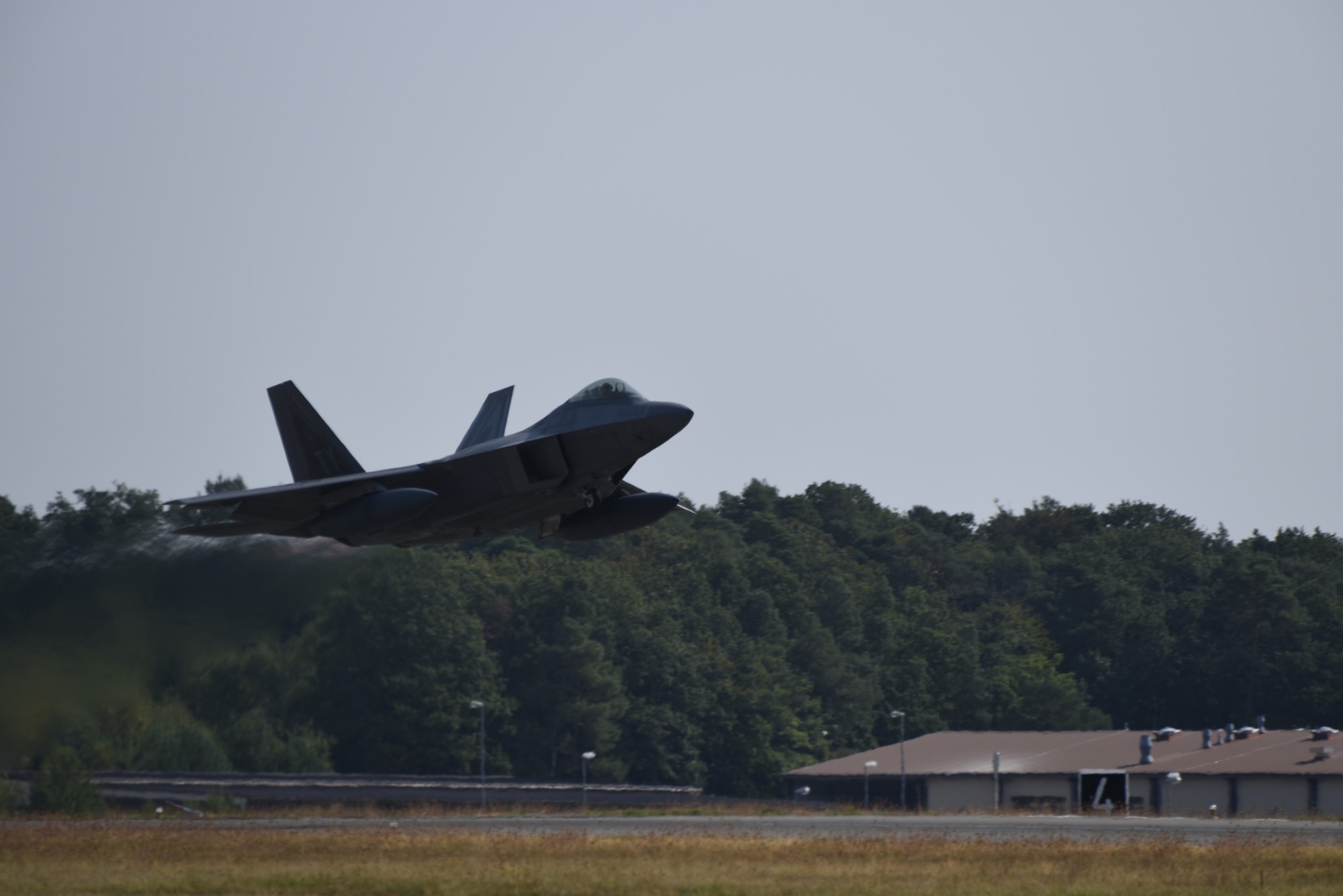 A U.S. Air Force F-22 Raptor from the 95th Fighter Squadron, 325th Fighter Wing, at Tyndall Air Force Base, Fla., takes-off from Spangdahlem Air Base, Germany, Aug. 29, 2018. The F-22s are heading back home after completing a Flying Training Deployment with other NATO partners. (U.S. Air Force photo by Airman 1st Class Branden Rae)