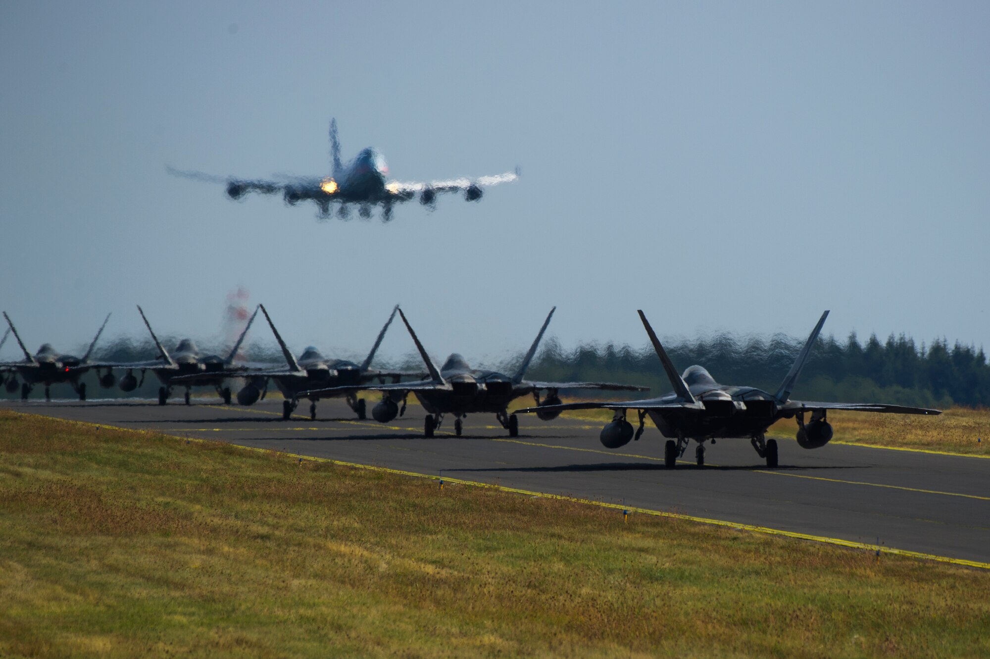 U.S. Air Force F-22 Raptors from the 95th Fighter Squadron, 325th Fighter Wing, Tyndall Air Force Base, Fla., taxi on the flightline at Spangdahlem Air Base, Germany, Aug. 29, 2018. The 95th FS deployed to Spangdahlem to conduct familiarization flight training with U.S. Air Forces in Europe-Air Forces Africa aircraft and Airmen. (U.S. Air Force photo by Airman 1st Class Valerie Seelye)