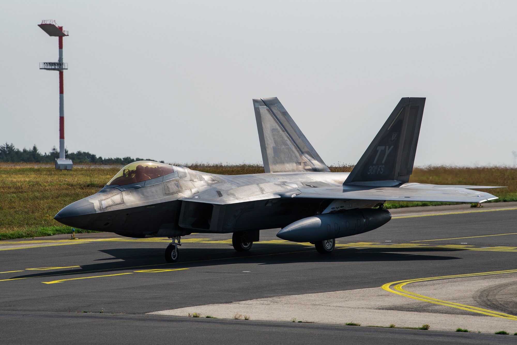 A U.S. Air Force F-22 Raptor from the 95th Fighter Squadron, 325th Fighter Wing, Tyndall Air Force Base, Fla., taxis on the flightline at Spangdahlem Air Base, Germany, Aug. 29, 2018. The Raptor prepared to depart after being deployed to Europe as a part of the European Deterrence Initiative, assuring allies of the Air Force's commitment to European security and stability. (U.S. Air Force photo by Airman 1st Class Valerie Seelye)