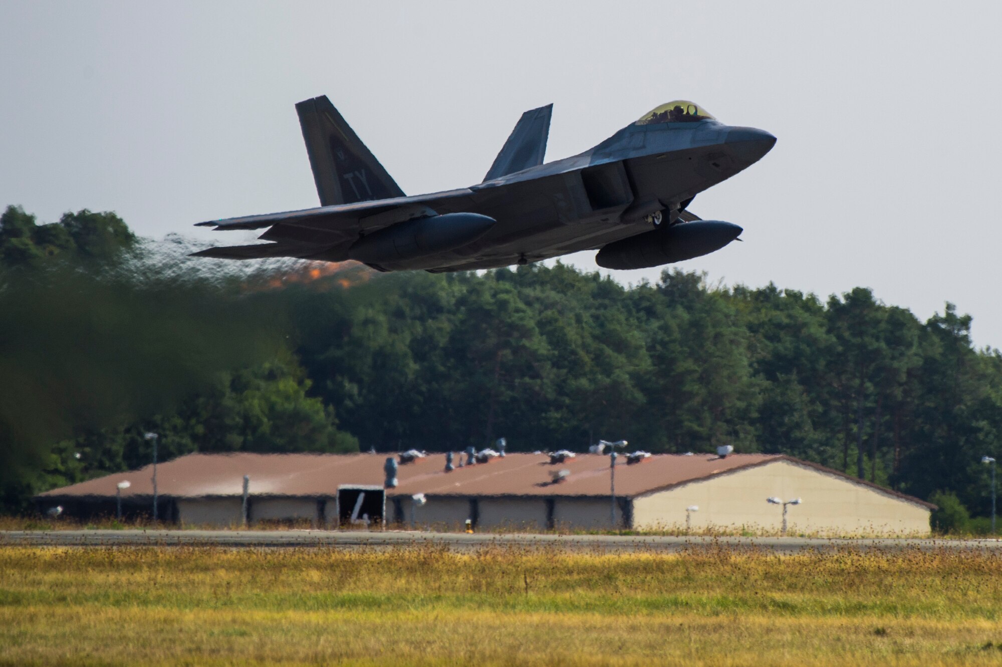 A U.S. Air Force F-22 Raptor from the 95th Fighter Squadron, 325th Fighter Wing, Tyndall Air Force Base, Fla., takes off at Spangdahlem Air Base, Germany, Aug. 29, 2018. Multiple F-22s departed Spangdahlem after being deployed for several weeks to train with NATO allies in Europe to further demonstrate the U.S. Air Force's commitment to regional security and stability. (U.S. Air Force photo by Airman 1st Class Valerie Seelye)