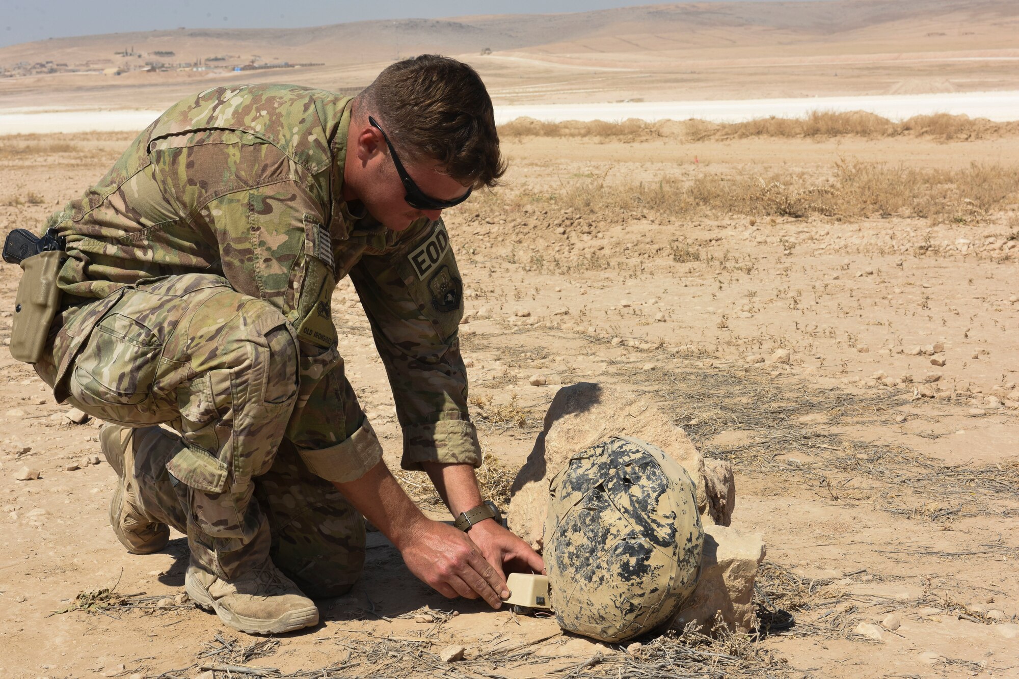 Tech. Sgt. Robert Powell, 441st Air Expeditionary Squadron Explosive Ordnance Disposal team lead, sets-up a simulated improvised explosive device for training Aug. 17, 2018, at an undisclosed location in Southwest Asia. Powell was recognized as the 386th Air Expeditionary Wing Rock Solid Warrior. (U.S. Air Force photo by Tech. Sgt. Caleb Pierce)