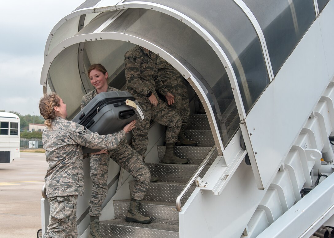 Airman 1st Class Eliza Rushlow and Airman 1st Class Kaitlin Berry, both personnelist with the 115th Force Support Squadron, Truax Field, Wisconsin, unload baggage from a KC-135 Stratotanker, assigned to the 128th Air Refueling Wing, General Mitchell Air National Guard Base, Wisconsin, Aug. 30, 2018, at Ramstein Air Base, Germany. The 115th FSS is TDY to Ramstein for approximately two-weeks as part of a movement for training mission. (U.S. Air National Guard photo by Airman 1st Class Cameron Lewis)