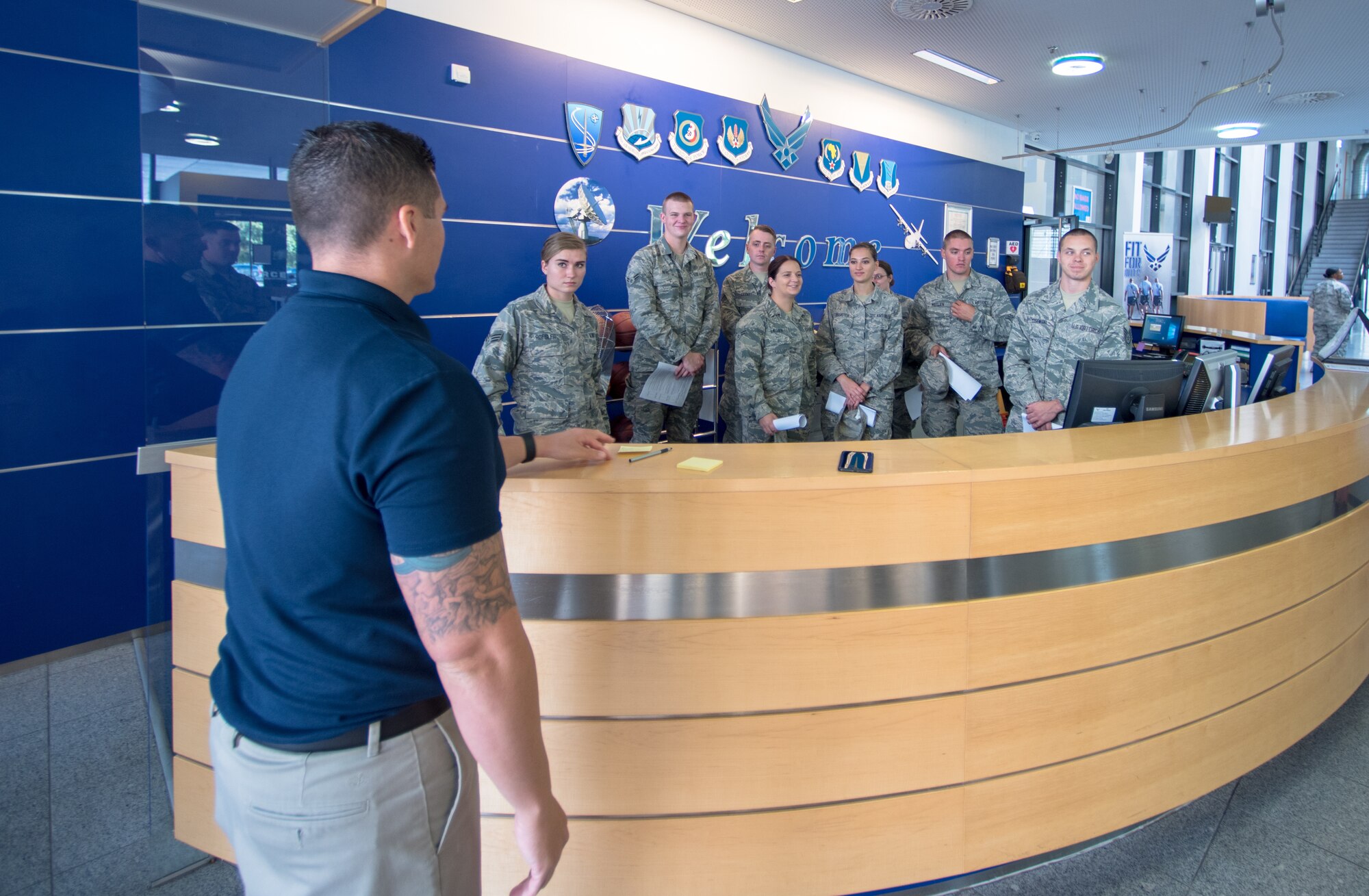 Tech. Sgt. Joseph Mctaggart, the NCO in charge of the southside fitness center with the 86th Force Support Squadron, Ramstein Air Base, Germany, briefs 115th FSS Airmen, that are TDY at Ramstein, on the importance of fitness operations Aug. 31, 2018. Force Support Squadron Airmen are critical to the overall Air Force mission by helping support a fit and ready force. (U.S. Air National Guard photo by Airman 1st Class Cameron Lewis)