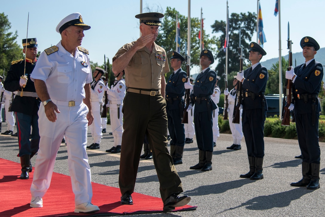 Marine Corps Gen. Joe Dunford, chairman of the Joint Chiefs of Staff, reviews troops in Athens, Greece.