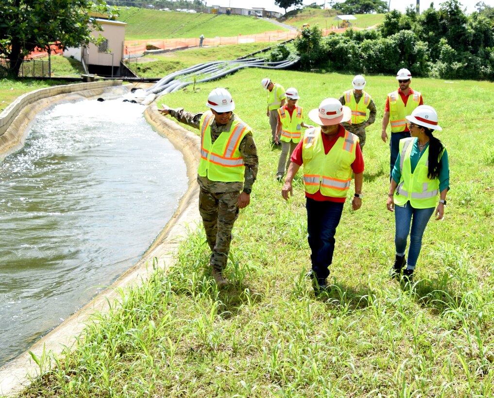 U.S. Army Corps of Engineers Task Force Recovery team toured the ongoing work at the Guajataca Dam, Isabela, Puerto Rico, Aug.31. The Wilmington District’s Wilmarie Pagan, front row right, is on the team. Ongoing construction of Guajataca Dam Interim Risk Reduction Measures will provide a 100-year level of protection to the dam and a 1000-year level of protection for the spillway and channel. (USACE photos courtesy Andrew Kornacki)