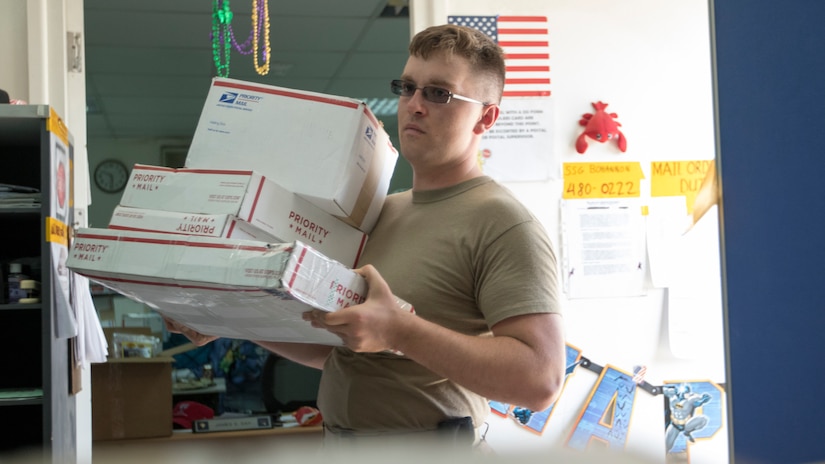 U.S. Army Spc. James Day, a human resources specialist with the 151st Regional Support Group, Massachusetts Army National Guard, attached to U.S. Army Central, brings packages into the USARCENT mail room to be sorted into groups for each unit and section attached to USARCENT at Camp Arifjan, Kuwait, Aug. 20, 2018. Consistent mail delivery in a deployed environment is a critical capability for overseas units.