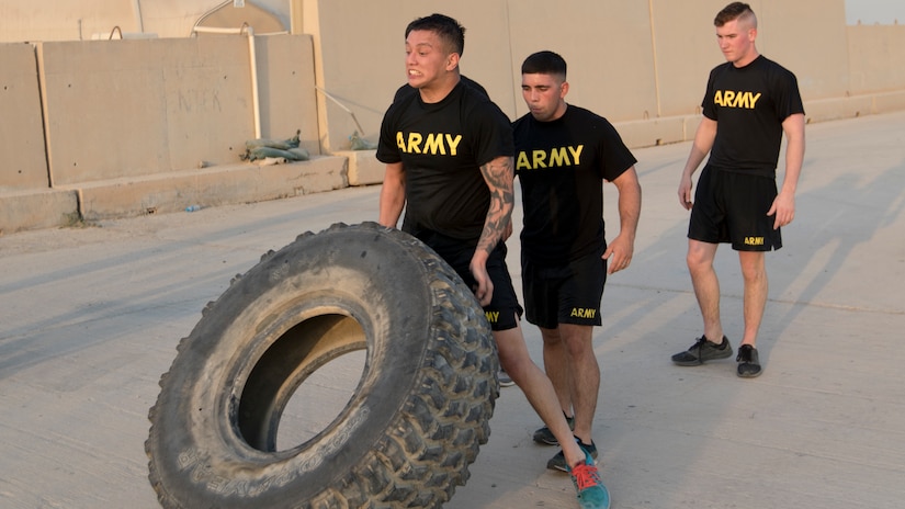 A U.S. Army Soldier flips a tire before rotating his position with teammates during one of the events of the 74th Engineer Dive Detachment's Diver Fitness Challenge at Kuwait Naval Base, Kuwait, Aug. 31, 2018. The competition offered an opportunity for Soldiers from many different units to test their abilities against each other with challenges many of the Soldiers had never faced before.
