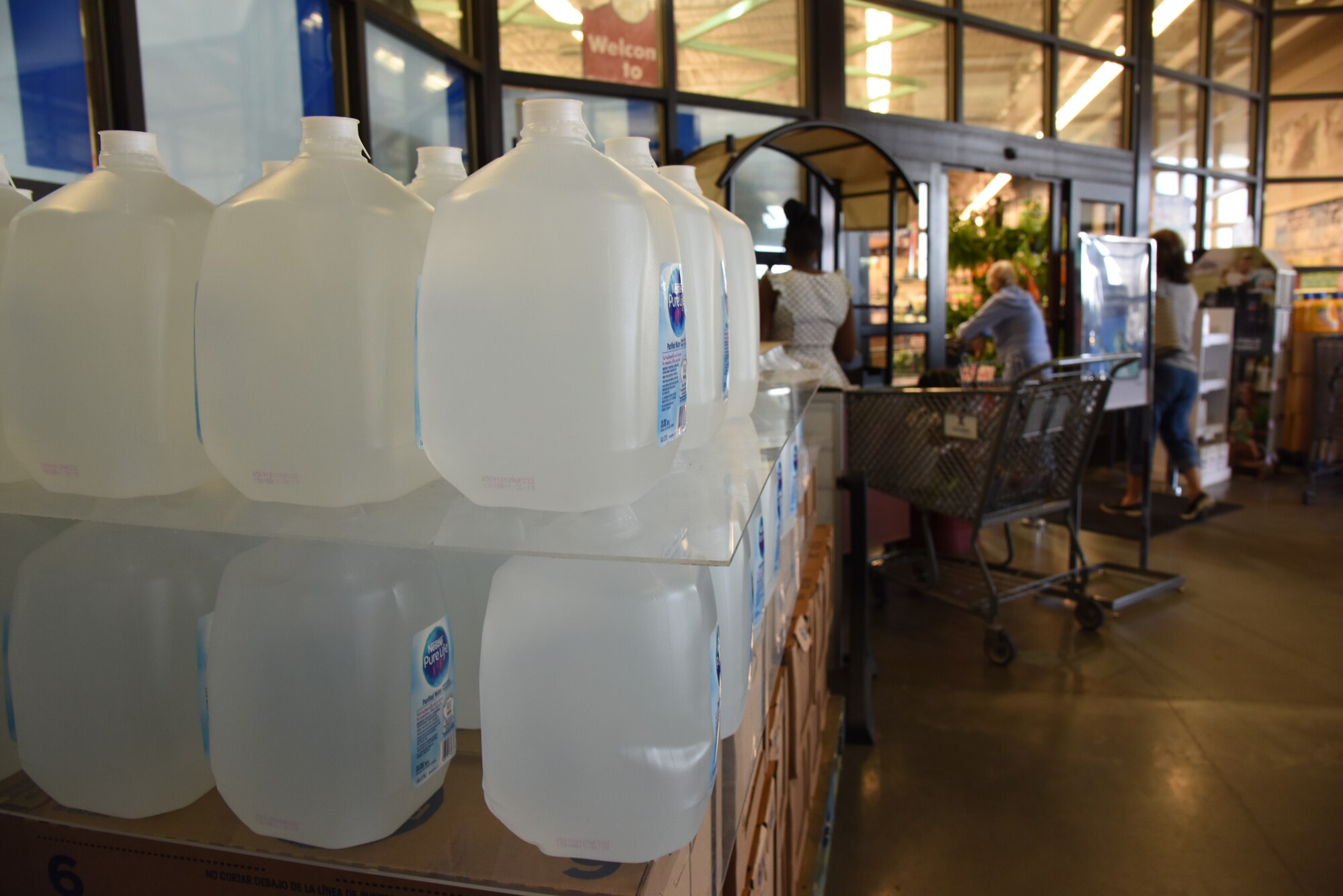 Jugs of water are on sale at the entrance of the Commissary on Keesler Air Force Base, Mississippi, Sept. 4, 2018. Safety measures are being taken around the base to prepare for the arrival of Hurricane Gordon to the Gulf Coast Sept. 4. (U.S. Air Force photo by Kemberly Groue)