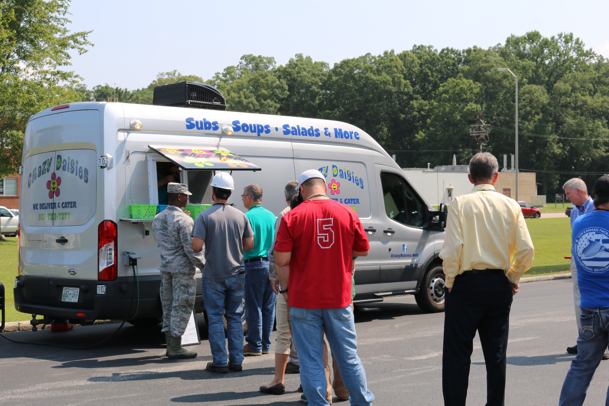 Arnold Air Force Base personnel line up to place their orders with Crazy Daisies. The Crazy Daisies food truck, located in the parking lot of the Main Auditorium, opened for business at Arnold AFB on Aug. 14. (U.S. Air Force photo by Bradley Hicks)