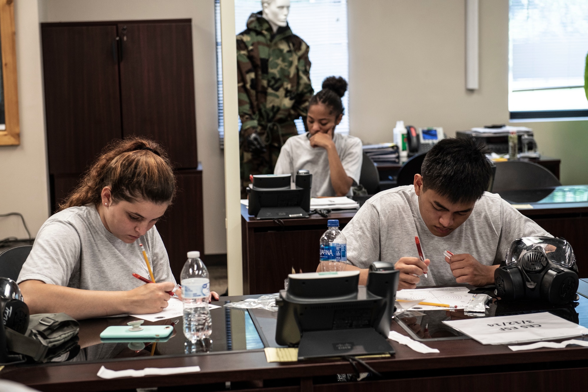 U.S. Air Force Airman 1st Class Zaria Smith, left, Airman 1st Class Kailee Johnson, middle, and Airman Angelo Madrazo, 20th Civil Engineer Squadron emergency management technicians, complete an eight-legged radiological survey at Shaw Air Force Base, S.C., Aug. 29, 2018.