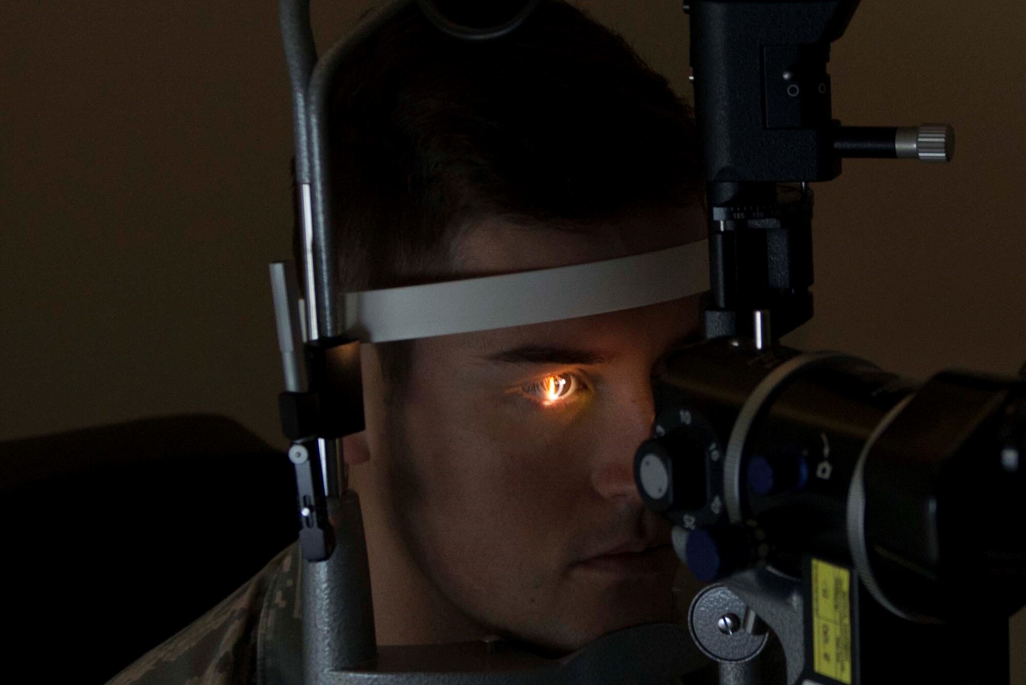 U.S. Air Force Senior Airman Samuel Collier, 20th Operational Support Squadron raws technician, has his eyes examined at Shaw Air Force Base, S.C., Sept. 4, 2018.