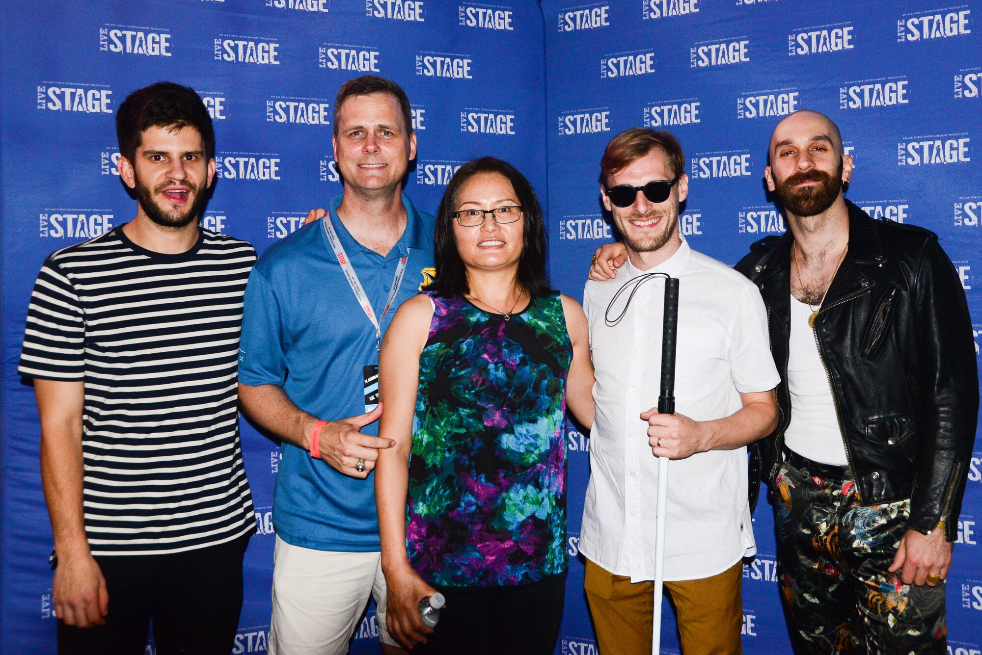 Col. Joel Safranek (second from left), 436th Airlift Wing commander, and his wife, Hana, pose with members of X Ambassadors during the band meet and greet prior to the End of Summer Music Festival Sept. 2, 2018, at Dover Air Force Base, Del. The rock band hails from Ithaca, N.Y. (U.S. Air Force photo by Airman 1st Class Dedan Dials)