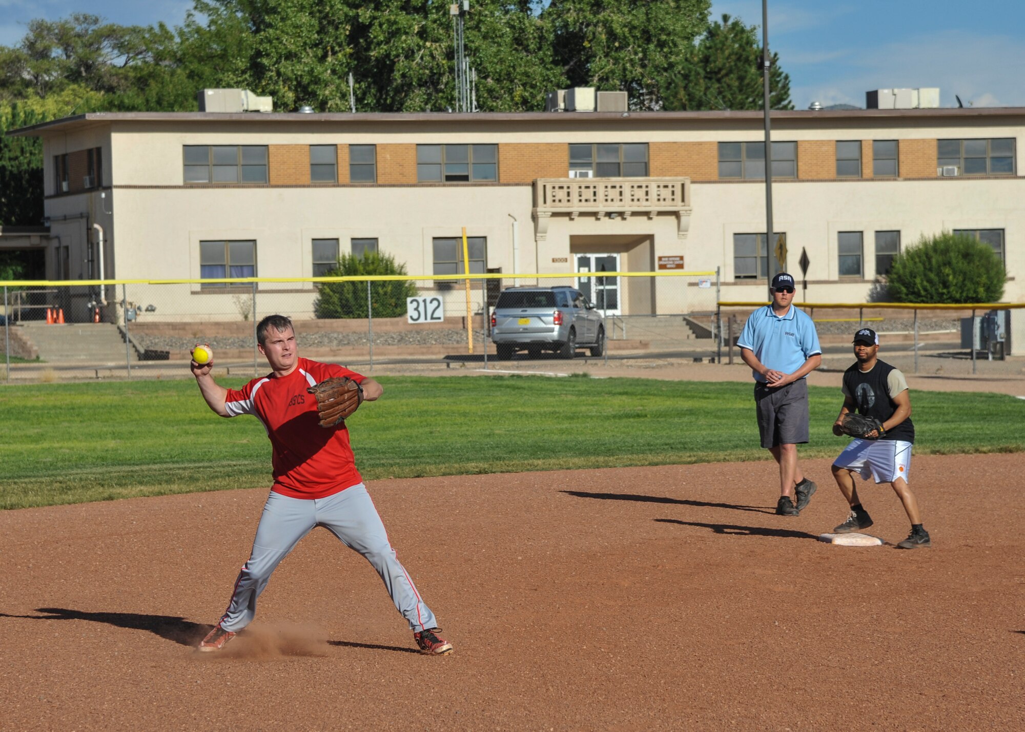 FSS/AFIA shortstop Tech Sgt. Matthew Miller prepares to cut down a runner at third base during intramural softball action Aug. 30 here. Miller and his team defeated the SMC/MDG team 20-7. FSS/AFIA meets SFG #2 tonight at 6:30 p.m. at the softball field adjacent to Marquez Park. (U.S. Air Force photo by Jim Fisher)
