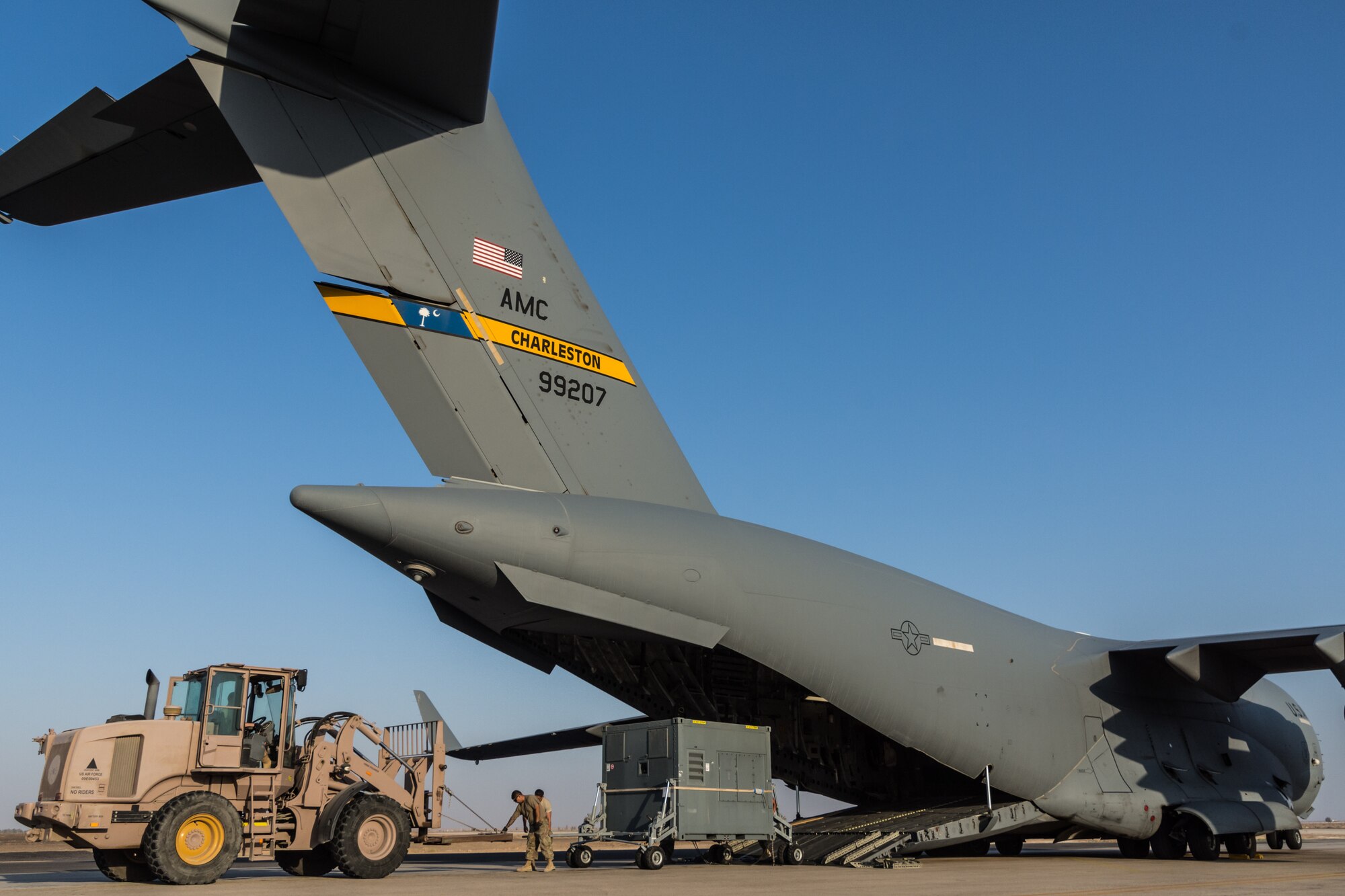 Personnel from the 816th Expeditionary Airlift Squadron and 332nd Air Expeditionary Wing offload cargo from a C-17 Globemaster III at an undisclosed location in Southwest Asia after being transported between U.S. Africa Command and U.S. Central Command, Aug. 28, 2018. Al Udeid-based aircraft have completed nearly 15 missions this calendar year between the two commands. (U.S. Air Force photo by Tech. Sgt. Ted Nichols/Released)