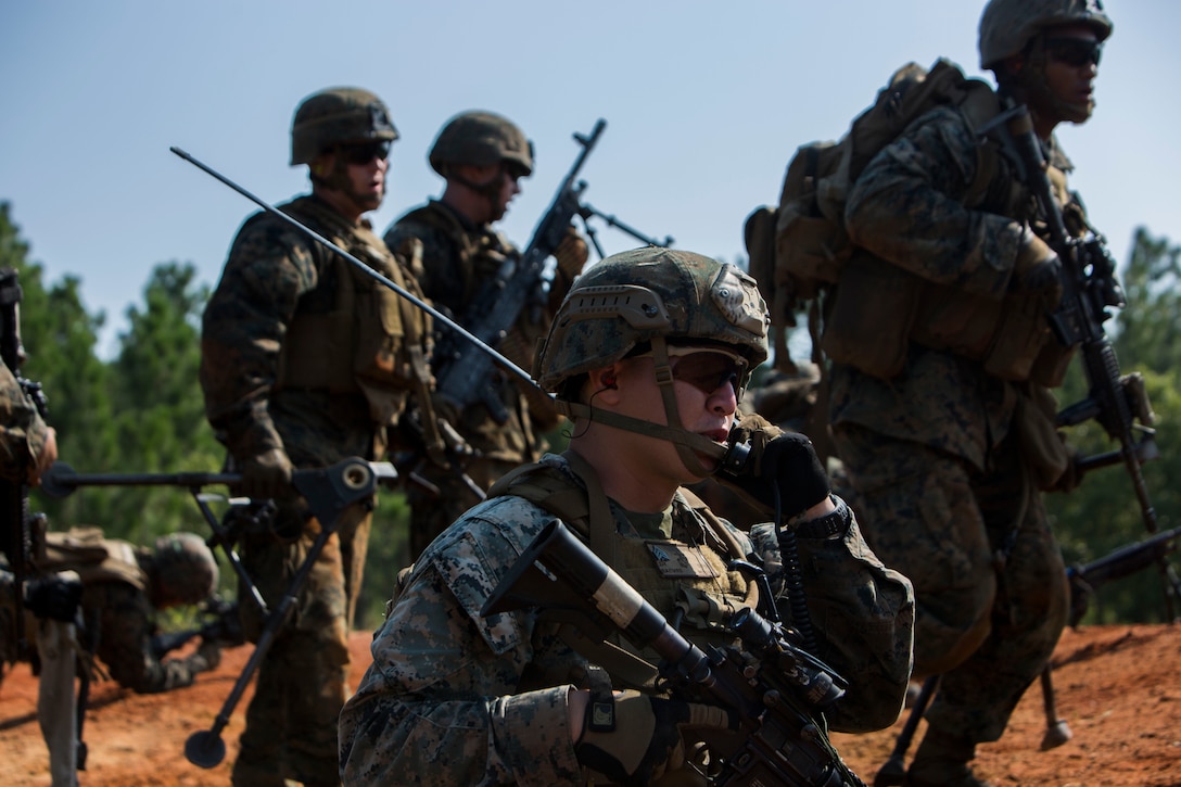 Marines move toward an objective during military operations in urban terrain training.