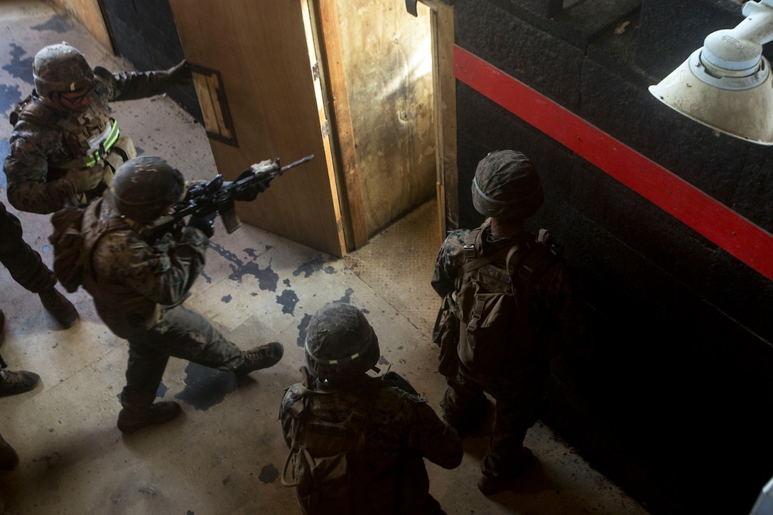 Marines prepare to clear a room during a training exercise.
