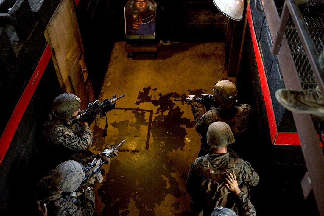 Marines close in on an objective during military operations in urban terrain training as part of an exercise..