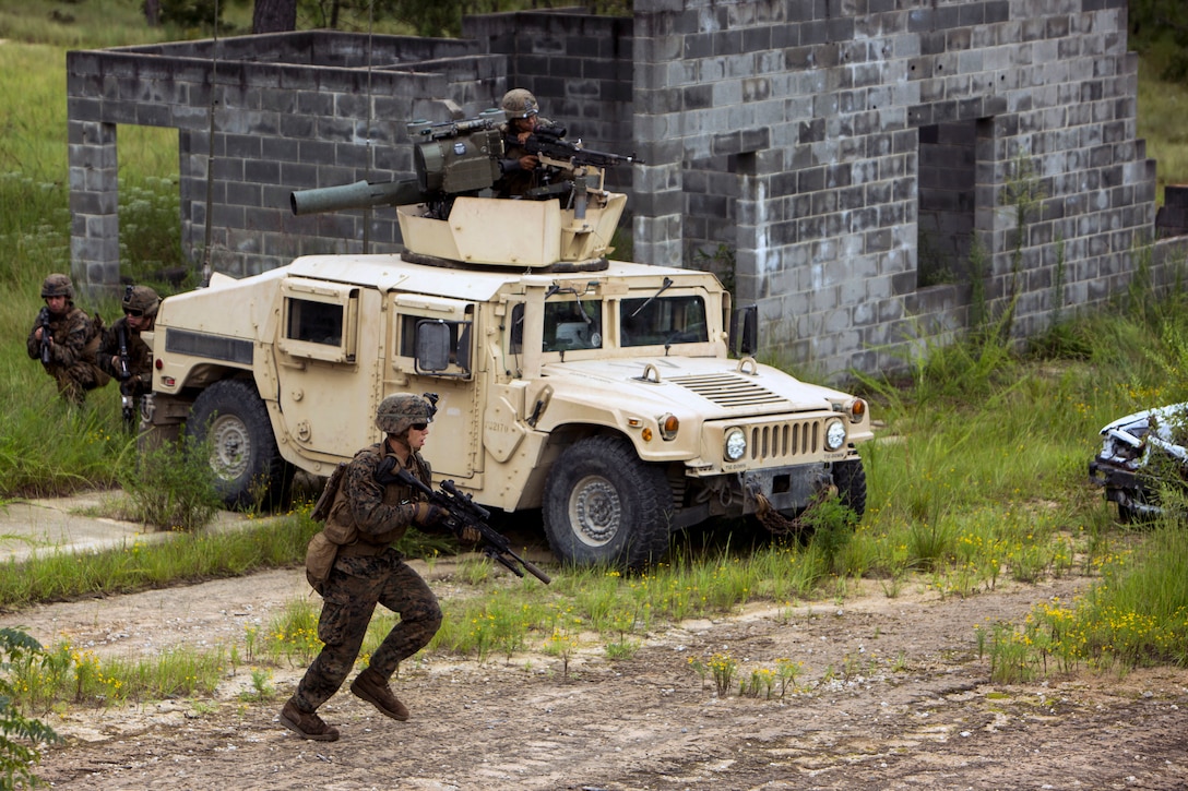 Marines move toward an objective during military operations in urban terrain training.