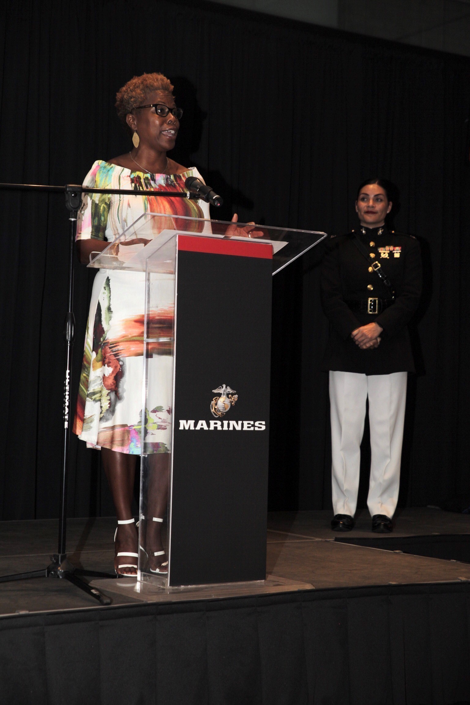 Jacqie McWilliams, a Central Intercollegiate Athletic Association (CIAA) commissioner, addresses attendees at a community leaders reception at the Bechtler Museum of Modern Art during the United States Marine Corps’ 2018 Marine Week in Charlotte, North Carolina, Sept. 4, 2018. Marine Week is a celebration of community, country and Corps, which provided the American public the experience of directly connecting with approximately 750 Marines. The CIAA is America’s oldest African-American athletic conference and a longtime targeted audience marketing partner of the Marine Corps. Diversity plays an important part in structuring the Marine Corps to better represent the different backgrounds, cultures and skills our citizens offer in service to our nation. Last year, diversity officer accessions accounted for 34.15% of officer accessions while 39.9% of enlisted accessions were diverse. Diversity accession success is a result of the hard work of our recruiting force and benefits from our robust community engagement activity, including Marine Week. Charlotte is the second-largest city in the southeast and growing. By partnering with Charlotte-based regional organizations like the Central Intercollegiate Athletic Association and engaging local audiences during events like those at Marine Week, the Marine Corps Recruiting Command ensures its message of aspirational service to the nation reaches all corners of the country. (Marine Corps photo by Lance Cpl. Naomi Marcom)