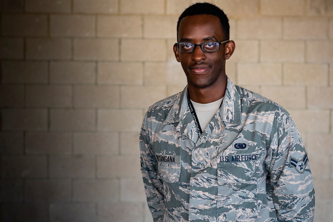 An airman poses for a photo.
