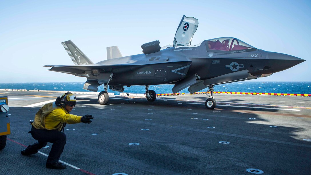 U.S. Navy Sailor Petty Officer 3rd Class Alexander Turla, an airman with the Essex Amphibious Ready Group, launches an F-35B Lightning II from Marine Fighter Attack Squadron 211, 13th Marine Expeditionary Unit, aboard the Wasp-class amphibious assault ship USS Essex, September 3, 2018. The Essex is the flagship for the Essex ARG and, with the embarked 13th MEU, is deployed to the U.S. 5th Fleet area of operations in support of naval operations to ensure maritime stability and security in the Central Region, connecting the Mediterranean and the Pacific through the western Indian Ocean and three strategic choke points.