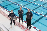 From left, graduate student Anton Cottrill, Dr. Jacopo Buongiorno and Dr. Michael Strano try out their neoprene wetsuits at a pool at MITâ€™s athletic center, June 15, 2018. Cottrill is holding the pressure tank used to treat the wetsuits with heavy inert gasses. Courtesy photo by Susan Young