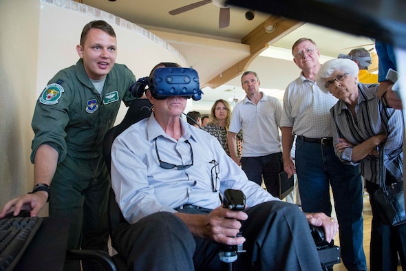 Capt. Jay Moore, a 560th Flying Training Squadron instructor pilot, helps demonstrate a virtual reality simulator Aug. 27, 2018 at Joint Base San Antonio-Randolph.