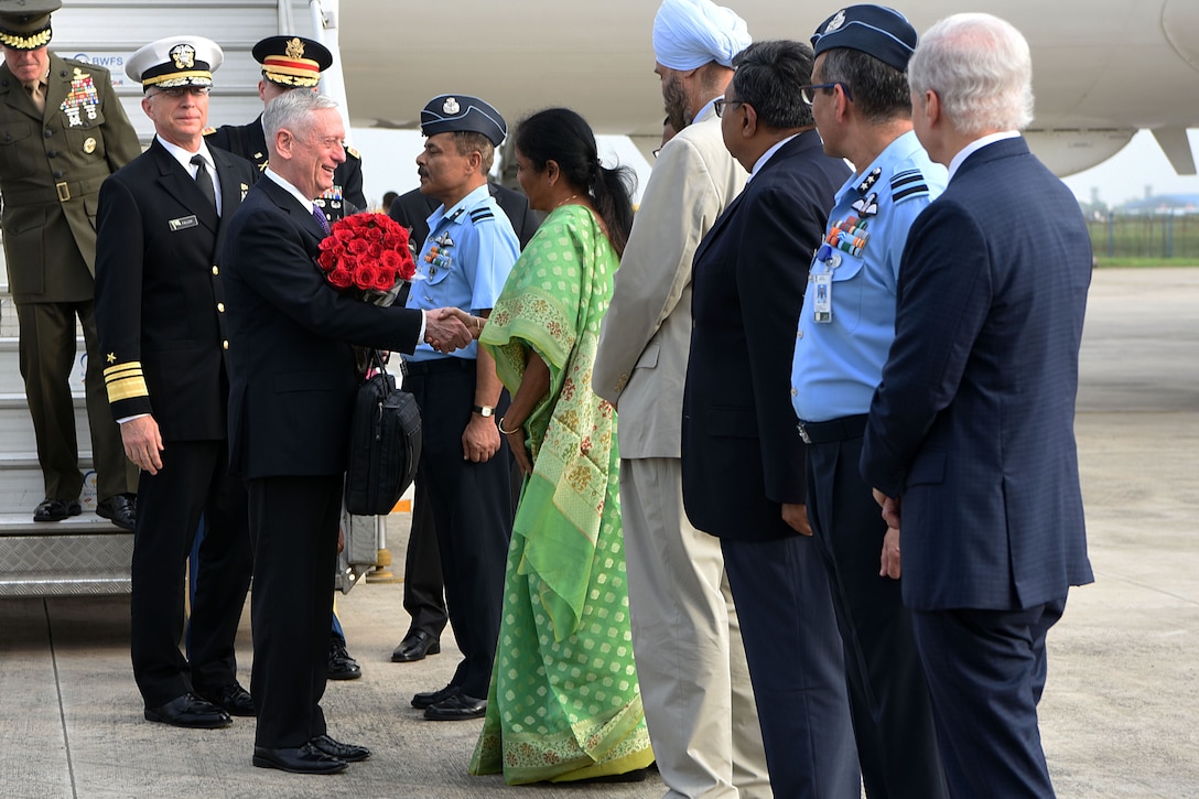 Defense Secretary James N. Mattis shakes hands with the Indian defense minister.