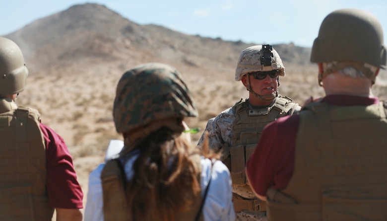 Lt. Col. James Birchfield, commanding officer, 3rd Battalion, 4th Marines, 7th Marine Regiment, explains the training to attendees of the ribbon cutting ceremony and live-fire demonstrations of the newly opened Johnson Valley Exclusive Military Use Area aboard the Marine Corps Air Ground Combat Center, Twentynine Palms, Calif., Aug. 24, 2018. The EMUA is open to all Marine Corps units and will allow for a more realistic level training that is capable of accommodating an entire Marine Air Ground Task Force. (U.S. Marine Corps photo by Sgt. Medina Ayala-Lo)