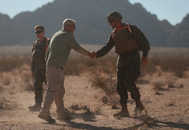 Brig. Gen. Roger Turner, Combat Center Commanding General, greets Jim Ricker, director, Government and External Affairs, prior to the ribbon cutting ceremony and live-fire demonstrations of the newly opened Johnson Valley Exclusive Military Use Area aboard the Marine Corps Air Ground Combat Center, Twentynine Palms, Calif., Aug. 24, 2018. The EMUA is open to all Marine Corps units and will allow for a more realistic level training that is capable of accommodating an entire Marine Air Ground Task Force. (U.S. Marine Corps photo by Sgt. Medina Ayala-Lo)