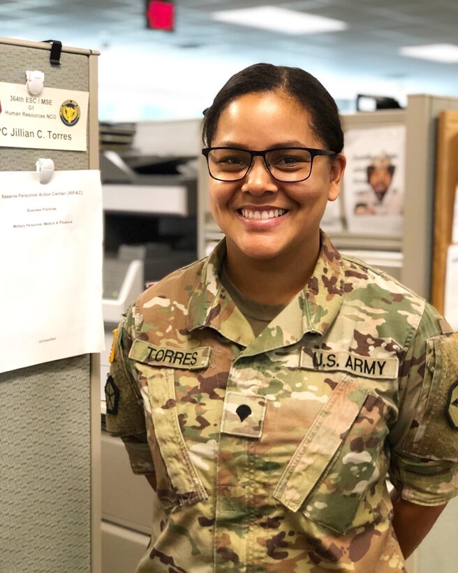U.S. Army Reserve Spc.Jillian Torres, human resources noncommissioned officer with the 364th Sustainment Command (Expeditionary), takes a brief break from reviewing personnel readiness reports during battle training assembly  at the Marysville Armed Forces Reserve Center, Aug. 26, 2018.