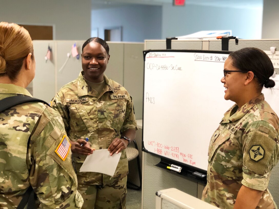 U.S. Army Reserve Spc. Jillian Torres (right), human resources noncommissioned officer with the 364th Sustainment Command (Expeditionary), discuss personnel readiness updates with her section Soldiers during battle training assembly at the Marysville Armed Forces Reserve Center, Aug. 26, 2018.