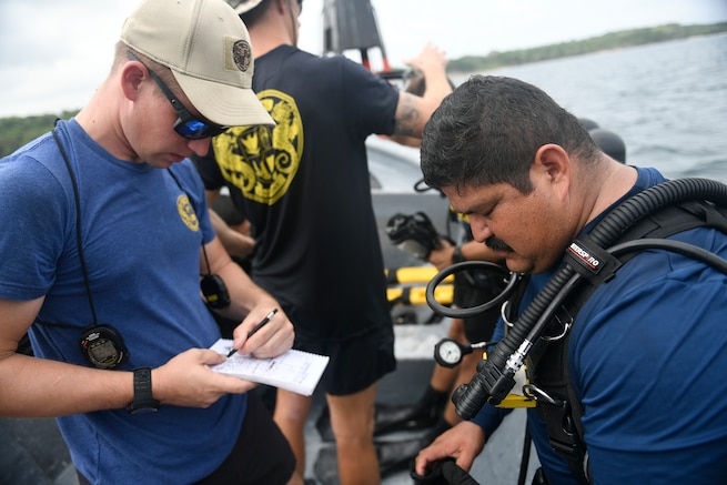 U.S. Navy divers prepare for a dive in Colombia.