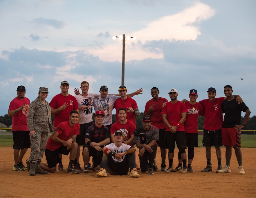 The 30th Intelligence Squadron softball team poses for a group photo during the intramural softball championship at Joint Base Langley-Eustis, Virginia, Aug. 30, 2018.