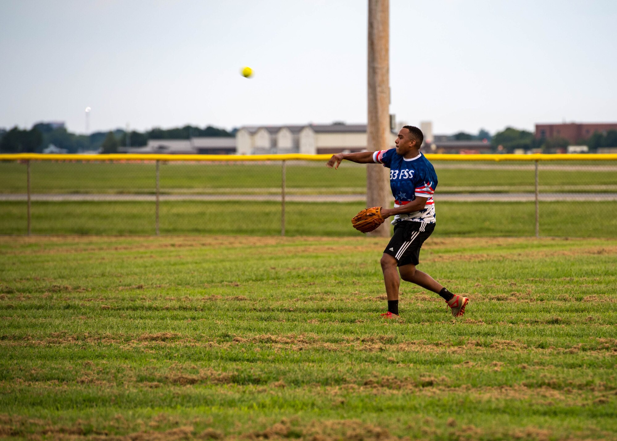 U.S. Air Force Senior Airman Jancarlos Uribe Cordero, 633rd Mission Support Group executive assistant, throws the ball from the outfield during the intramural softball championship at Joint Base Langley-Eustis, Virginia, Aug. 30, 2018.