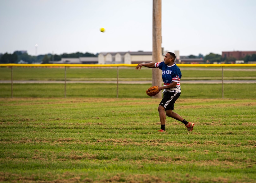 U.S. Air Force Senior Airman Jancarlos Uribe Cordero, 633rd Mission Support Group executive assistant, throws the ball from the outfield during the intramural softball championship at Joint Base Langley-Eustis, Virginia, Aug. 30, 2018.