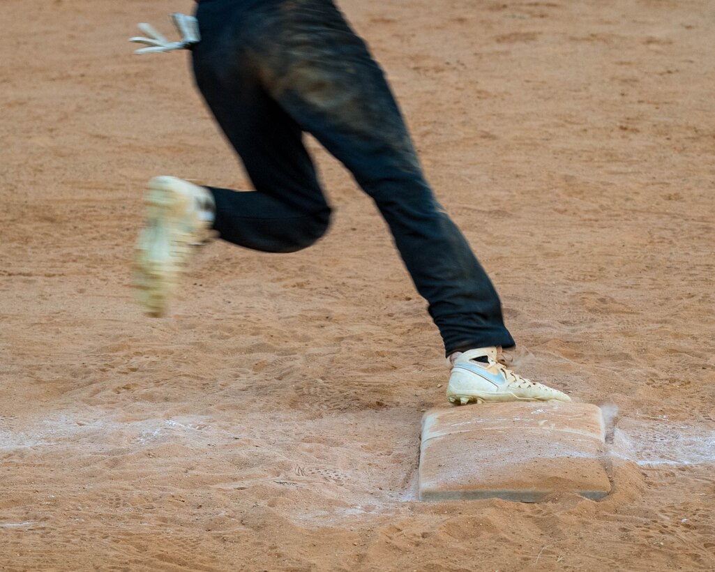 U.S. Air Force Airman 1st Class Mathew Morton, 45th Intelligence Squadron runs the bases during the intramural softball championship at Joint Base Langley-Eustis, Virginia, Aug. 30, 2018.