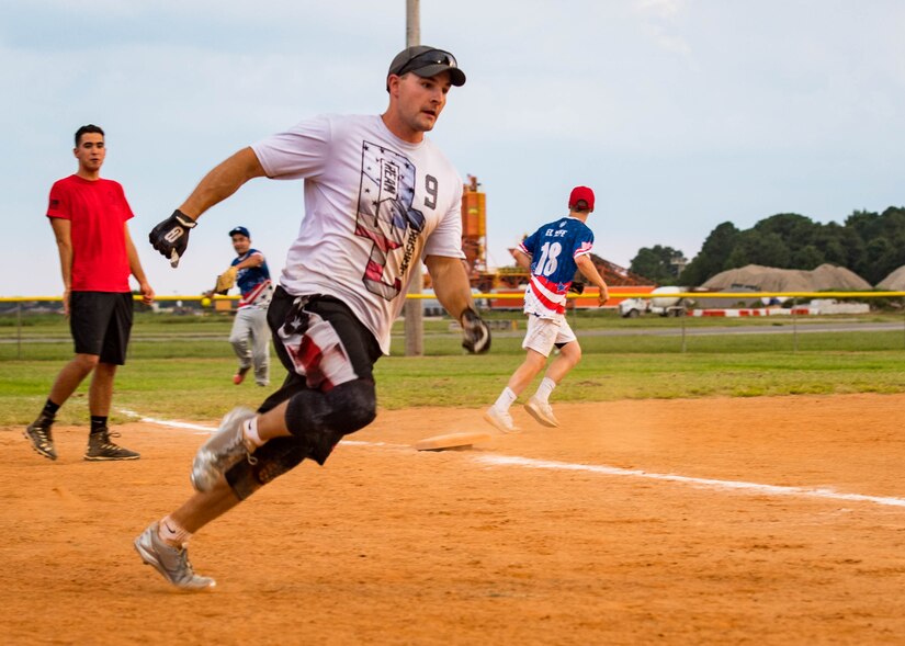 U.S. Air Force Staff Sgt. Nicholas Matzdorf, 30th Intelligence Squadron imagery missions’ supervisor runs towards home plate during the intramural softball championship at Joint Base Langley-Eustis, Virginia, Aug. 30, 2018.