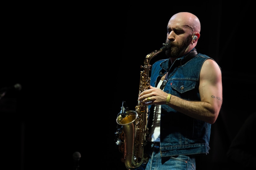 Sam Harris, X Ambassadors lead vocalist, plays the saxophone during the End of Summer Music Festival hosted by Air Force Services Activities at Joint Base Langley-Eustis, Virginia, Sep. 1, 2018.