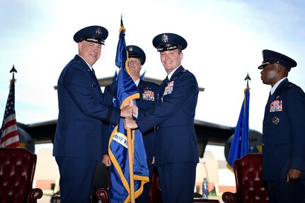 Col. Jeff Nelson, center right, relinquishes command of the 628th Air Base Wing and Joint Base Charleston to Maj. Gen. John Gordy II left, U.S. Air Force Expeditionary Center commander, during a change of command ceremony Sept. 5, 2018, at Joint Base Charleston, S.C. Col. Terrence Adams, right, replaced Nelson as commander of the wing and joint base. Joint Base Charleston is one of 12 Department of Defense joint bases and is host to over 60 DOD and federal agencies. The 628th ABW delivers installation support to over 90,000 Airmen, Sailors, Soldiers, Marines, Coast Guardsmen, civilians, dependents and retirees across four installations including the Air Base and Naval Weapons Station.