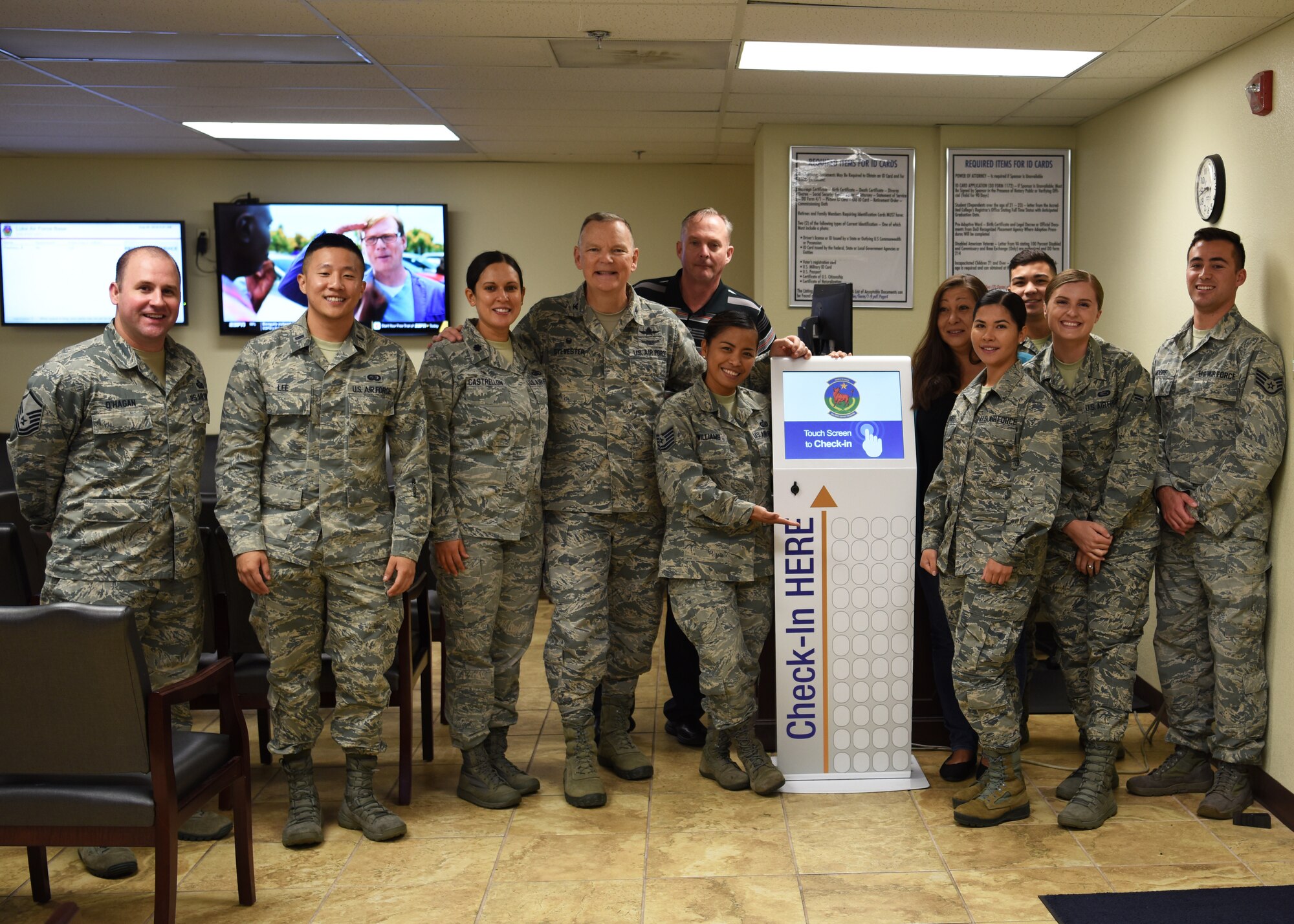 U.S. Air Force Col. Robert Sylvester, 56th Mission Support Group commander, stands with the 56th Force Support Squadron Military Personnel Flight Airmen in support of the newly installed check-in kiosk Aug. 29, 2018 at Luke Air Force Base, Ariz.