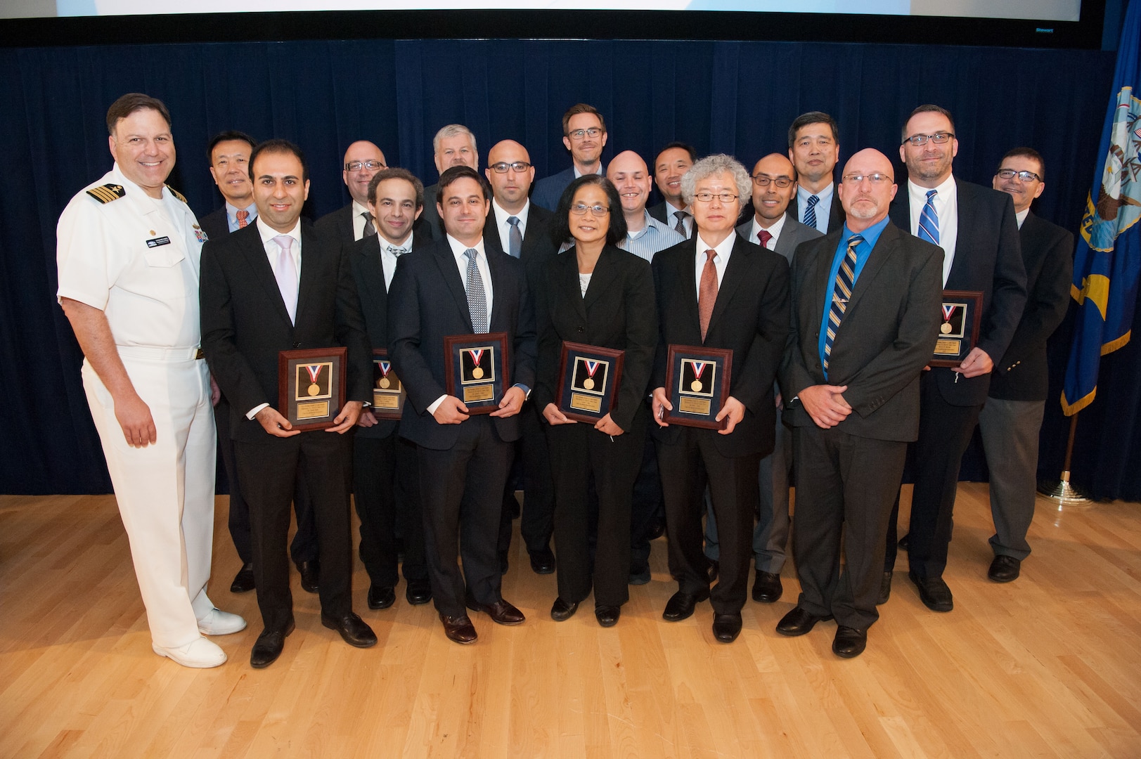 The Computational Research and Engineering Acquisition Tools and Environments (CREATE) " Ships Team receives the Vice Adm. Emory S. Land Award for collaboration excellence at the Naval Surface Warfare Center, Carderock Division Honor Awards ceremony Aug. 28, 2018, in West Bethesda, Md. The team spanned all the technical codes at Carderock and they are: Dr. Shawn Aram, Raymond DeFrese, Dr. Keegan Delaney, Dr. John Gilbert, Dr. Alexander Gray, Todd Heidenreich, Jeffrey Hough, Dr. Jun Li, Dory Lummer, Michael Miraglia, Cathy Ngo, Dr. Bong Rhee, Cullen Sarles, Dr. Hua Shan, Jonathan Stergiou, Richard Van Eseltine, Dr. Abel Vargas and Wesley Wilson. (U.S. Navy photo by Nicholas Brezzell/Released)