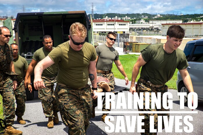 Medical personnel assigned to 3rd Medical Battalion, 3rd Marine Logistics Group, escort a simulated casualty during a Navy Medicine Augmentation Program pre-deployment training at Medical Simulation Training Center South, Okinawa, Japan, Aug. 25, 2018.  Medical personnel with 3rd Medical Bn., 3rd MLG, worked with medical augments to prepare Role II medical facilities. Role II facilities provide a place for injured service members to be received while providing enhanced capabilities such as ultrasound, X-ray and surgery. (U.S. Marine Corps photo by Cpl. Joshua Pinkney)